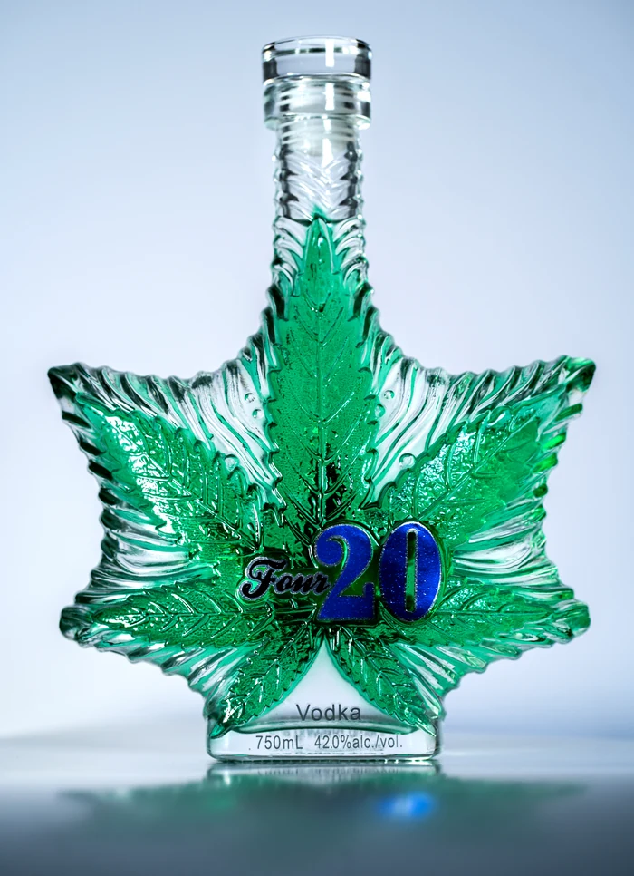 Genuine Four20 hemp vodka bottle with sculpted emerald green glass